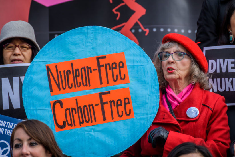 Gathering at the steps of City Hall in New York, a group advocating for the Comptroller of New York to divest the city’s pensions and finances from nuclear weapons producers.